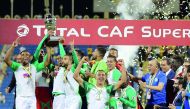 Raja Casablanca players celebrate after winning the African Super Cup final against Esperance Sportive de Tunis at the Thani bin Jassim Stadium, in Doha, yesterday. Picture: Mohamed Farag