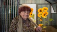 French artist Agnes Varda poses next to her installation named 