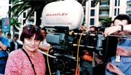 French director Agnes Varda gives instructions to actors next to a camera in Cannes during the shooting of her next movie 