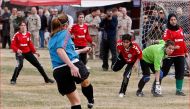 The Afghan National women's soccer team plays a friendly match in Kabul against a women's team from the NATO-led International Security Assistance Force (ISAF) on October 29, 2010. Reuters/Omar Sobhani