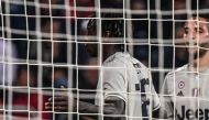 Juventus' Italian forward Moise Kean celebrates in front of Cagliari's fans after scoring during the Italian Serie A football march Cagliari vs Juventus on April 2, 2019 at the Sardignia Arena in Cagliari. / AFP / Marco BERTORELLO