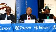 Eskom's Group Chief Executive Phakamani Hadebe, South African Minister of Enterprise Pravin Gordhan, and Eskom board chairman Jabu Mabuza give a joint press conference to update on the current status of electricity supply during a visit at the Lethabo Pow