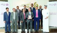Commercial Bank Group CEO Joseph Abraham  and other senior officials of the bank with the award.