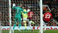 A header by Barcelona’s Luis Suarez (second left), deflects off Manchester United’s Luke Shaw (right), into their own goal during the Champions League Quarter Final First Leg match played at the Old Trafford in Manchester, Britain, on Wednesday.
