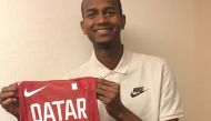 Qatar’s reigning world high jump champion, Mutaz Essa Barshim, holding  his London 2012 Olympic Games competition vest.