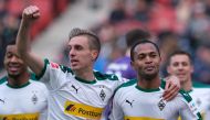 Moenchengladbach's Brazilian forward Raffael (R) celebrates scoring with his team-mate Moenchengladbach's German midfielder Patrick Herrmann during the German first division Bundesliga football match between Hanover and Moenchengladbach on April 13, 2019 