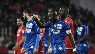  Match is interrupted and Amiens' French defender Prince Desir Gouano (C) points supporters after hearing racists insults during the French L1 football match between Dijon (DFCO) and Amiens on April 12, 2019 in Gaston Gerard stadium in Dijon. / AFP / JEFF