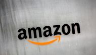 FILE PHOTO: Amazon.com's logo is seen at Amazon Japan's office building in Tokyo, Japan, August 8, 2016. REUTERS/Kim Kyung-Hoon