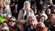 People gather outside the Saint Sulpice church during a mass two days after a massive fire devastated large parts of the gothic structure of Notre-Dame Cathedral in Paris, France, April 17, 2019. Reuters/Gonzalo Fuentes
