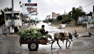 A Palestinian boy rides a donkey cart in Beit Hanun, northern Gaza Strip in this file photo. (AFP/Mahmud Hams)