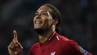 Liverpool's Dutch defender Virgil van Dijk celebrates after scoring his team's fourth goal during the UEFA Champions League quarter-final second leg football match between FC Porto and Liverpool at the Dragao Stadium in Porto on April 17, 2019. / AFP / Pa