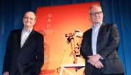 President of the Cannes Film Festival Pierre Lescure (L) and General Delegate of the Cannes Film Festival Thierry Fremaux pose in front of the Cannes offical poster during the presentation of the 72nd Cannes Film Festival Official Selection, in Paris on A