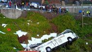 A video grab obtained from drone footage shows the wreckage of a tourist bus that crashed on April 17, 2019 in Canico, on the Portuguese island of Madeira. AFP 