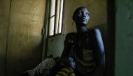 A mother and her sick son wait for treatment at the Udier primary health and care center supported by the International Committee of the Red Cross (ICRC) in Udier, in the Upper Nile region, on March 7, 2019.  AFP / Simon Maina 