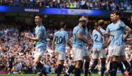 Manchester City's English midfielder Phil Foden (L) celebrates scoring the opening goal during the English Premier League football match between Manchester City and Tottenham Hotspur at the Etihad Stadium in Manchester, north west England, on April 20, 20