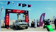 Qatari driver Jahman Jaralla and his co-driver Feras Allouh celebrate after winning Round 4 of the 2019 Qatar Manateq Baja, yesterday.