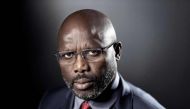 This file photo taken on September 25, 2017 shows former football player and candidate in Liberia's presidential elections, George Weah posing during a photo session in Paris. AFP / Joel Saget 