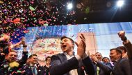 Ukrainian comedian and presidential candidate Volodymyr Zelensky reacts after the announcement of the first exit poll results in the second round of Ukraine's presidential election at his campaign headquarters in Kiev on April 21, 2019. / AFP / Genya SAVI