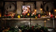 A portrait of slain Bulgarian television journalist Viktoria Marinova during a candle-light vigil in the city of Rousse on October 8, 2018. AFP/Dimitar Dilkoff