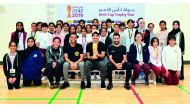 The school students pose for a picture with the Amir Cup during the Trophy Tour to Qatar  Academy Al Wakrah yesterday.