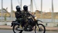 Two soldiers on a motorbike patrol along a street in Colombo on April 25, 2019, following a series of bomb blasts targeting churches and luxury hotels on the Easter Sunday in Sri Lanka. AFP / Ishara S Kodikara 