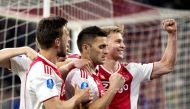 Dusan Tadic (C) of Ajax Amsterdam celebrates with teammates after scoring a goal during the Dutch Eredivisie football match Ajax Amsterdam vs Vitesse Arnhem at the Johan-Cruijff ArenA stadium in Amsterdam, on April 23 2019. - Netherlands OUT / AFP / ANP /