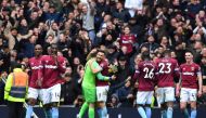 West Ham United's Polish goalkeeper Lukasz Fabianski (centre left) and West Ham United's Scottish midfielder Robert Snodgrass (centre right) celebrate on the pitch after the English Premier League football match between Tottenham Hotspur and West Ham Unit