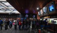 Venezuelan filmgoers queue to withdraw tickets to watch the first screening in Venezuela of Marvel Studios' 