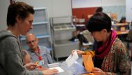 A woman casts her vote at a polling station during Spain's general election in Madrid, Spain, April 28, 2019. REUTERS/Jon Nazca
