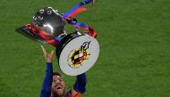 Barcelona's Argentinian forward Lionel Messi raises La Liga trophy as he celebrates becoming La Liga champions after winning the Spanish League football match between FC Barcelona and Levante UD at the Camp Nou stadium in Barcelona on April 27, 2019.  AFP