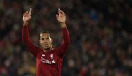 Liverpool's Dutch defender Virgil van Dijk acknowledges supporters during the English Premier League football match between Liverpool and Huddersfield at Anfield in Liverpool, north west England on April 26, 2019. AFP / Oli Scarff 