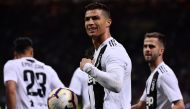 Juventus' Portuguese forward Cristiano Ronaldo (C) celebrates after scoring a goal during the Italian Serie A football match between Inter Milan and Juventus on April 27, 2019 at the San Siro stadium in Milan. / AFP / MARCO BERTORELLO