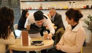 An employee serves coffee at Agonist, a coffee shop that hires people with special needs, in Zalka, Lebanon, February 26, 2018. Thomson Reuters Foundation/Heba Kanso