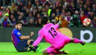 Barcelona’s Luis Suarez (left) scores their opening goal against Liverpool during the Champions League Semi-Final First Leg match played at the Camp Nou in Barcelona, Spain, yesterday. Reuters/Sergio Perez 