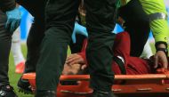 Liverpool's Egyptian midfielder Mohamed Salah reacts as he is placed on a stretcher after injuring himself in a challenge with Newcastle United's Slovakian goalkeeper Martin Dubravka (not pictured) during the English Premier League football match between 
