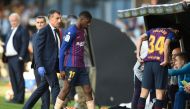 Barcelona's French forward Ousmane Dembele leaves the pitch after resulting injured during the Spanish league football match between RC Celta de Vigo and FC Barcelona at the Balaidos stadium in Vigo on May 4, 2019. / AFP / Miguel RIOPA