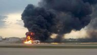A passenger plane is seen on fire after an emergency landing at the Sheremetyevo Airport outside Moscow, Russia May 5, 2019. REUTERS/Nadezhda Polomoshnova 