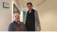 Lars Holstein, in a wheelchair, (left) and Jeanett Dian Amonsen (right), employees at Huset Venture, a Danish social enterprise which hires people with disabilities, pose at their office in Aarhus, Denmark on Mar 19, 2019. Thomson Reuters Foundation/Thin 