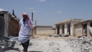 A Syrian man inspects the totally destroyed building after an attack by Assad regime forces on residential areas located inside northern Syria’s de-escalation zones, at Ras al-Ayn town of Saraqib district in Idlib, Syria on May 07, 2019. ( Hasan Muhtar - 