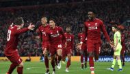 Liverpool's Belgian striker Divock Origi (R) celebrates after scoring their fourth goal during the UEFA Champions league semi-final second leg football match between Liverpool and Barcelona at Anfield in Liverpool, north west England on May 7, 2019. AFP /