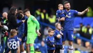Chelsea's French striker Olivier Giroud waves to fans as he walks with his family following the English Premier League football match between Chelsea and Watford at Stamford Bridge in London on May 5, 2019.  AFP / Daniel LEAL-OLIVAS 