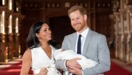 Britain's Prince Harry and Meghan, Duchess of Sussex hold their baby son, who was born on Monday morning, during a photocall in St George's Hall at Windsor Castle, in Berkshire, Britain May 8, 2019. (Dominic Lipinski/Pool via REUTERS)
