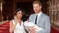 :Britain's Prince Harry, Duke of Sussex (R), and his wife Meghan, Duchess of Sussex, pose for a photo with their newborn baby son in St George's Hall at Windsor Castle in Windsor, west of London on May 8, 2019. (AFP / POOL / Dominic Lipinski)