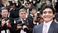 Former Argentinian football player Diego Maradona poses as he arrives to attend the screening of Steven Soderbergh's film 'Che' at the 61st Cannes International Film Festival on May 21, 2008 in Cannes, southern France.  AFP / Francois Guillot 