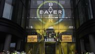 Activists stage a flash protest organised by the international movement 'Attac' at the offices of Bayer -which recently acquired Monsanto- in La Garenne Colombes near the financial district of La Defence on the outskirts of Paris on March 14, 2019. AFP/ P