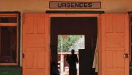 A Central African internally displaced woman holds a child inside an emergency room of the MSF-run hospital in Bangassou on May 26, 2017. AFP/Saber Jendoubi