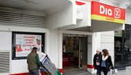File photo of people walk outside a DIA supermarket in central Madrid, Spain, February 23, 2015. REUTERS/Juan Medina/File Photo