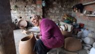 Sabiha Ayari, a Tunisian potter in her fifties, works in the village of Sejnane in the northern Tunisian province of Bizerte, about 120 kilometres (75 miles) west of the capital Tunis, on March 14, 2019. AFP / Fethi Belaid 