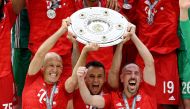 Bayern Munich's Arjen Robben, Rafinha and Franck Ribery celebrate with the trophy after winning the Bundesliga REUTERS/Andreas Gebert 