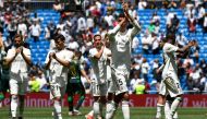 Real Madrid's players acknowledge fans at the end of the Spanish League football match between Real Madrid and Real Betis at the Santiago Bernabeu stadium in Madrid on May 19, 2019. / AFP / PIERRE-PHILIPPE MARCOU